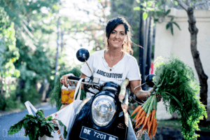 Chef Cynthia Louise Riding a Motorcycle with Vegetables